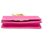 A bright pink leather clutch bag with a gold-tone chain strap and a gold-tone front clasp, shown against a plain white background.
