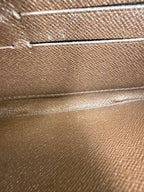 Louis Vuitton Zippy Wallet in Damier Ebene Canvas