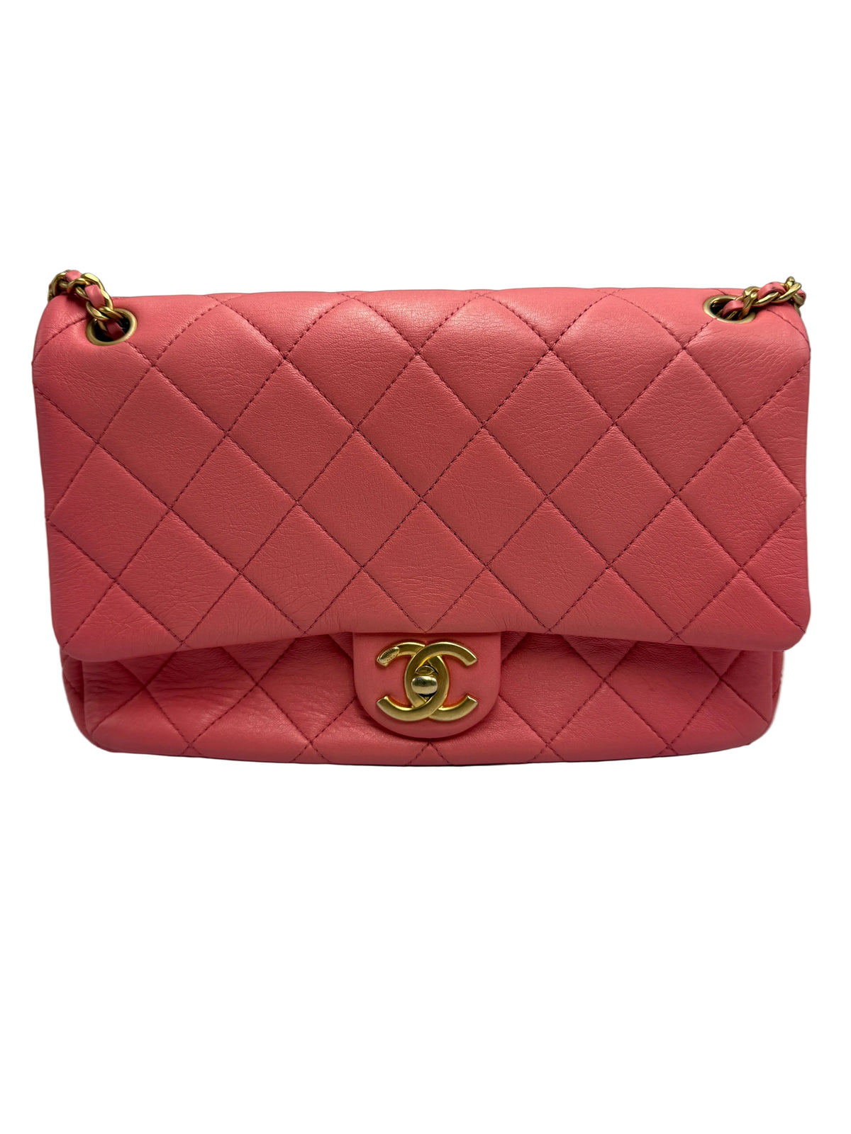 Shop the Chanel 19 small flap bag in coral pink quilted leather with multi-tone chain strap and leather-intertwined CC logo. 100% authentic pre-loved bag.