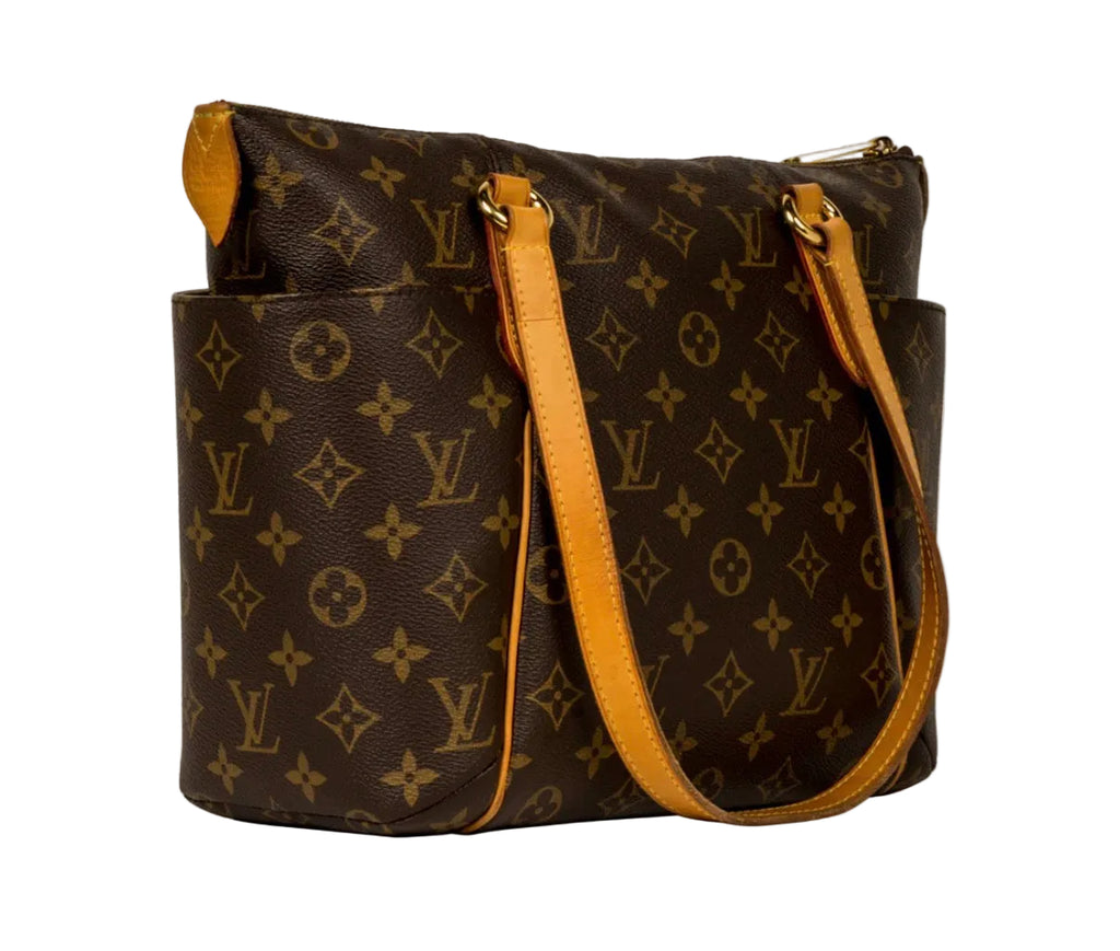 Louis Vuitton monogram canvas shoulder bag with tan leather handles and trim, shown on a white background.