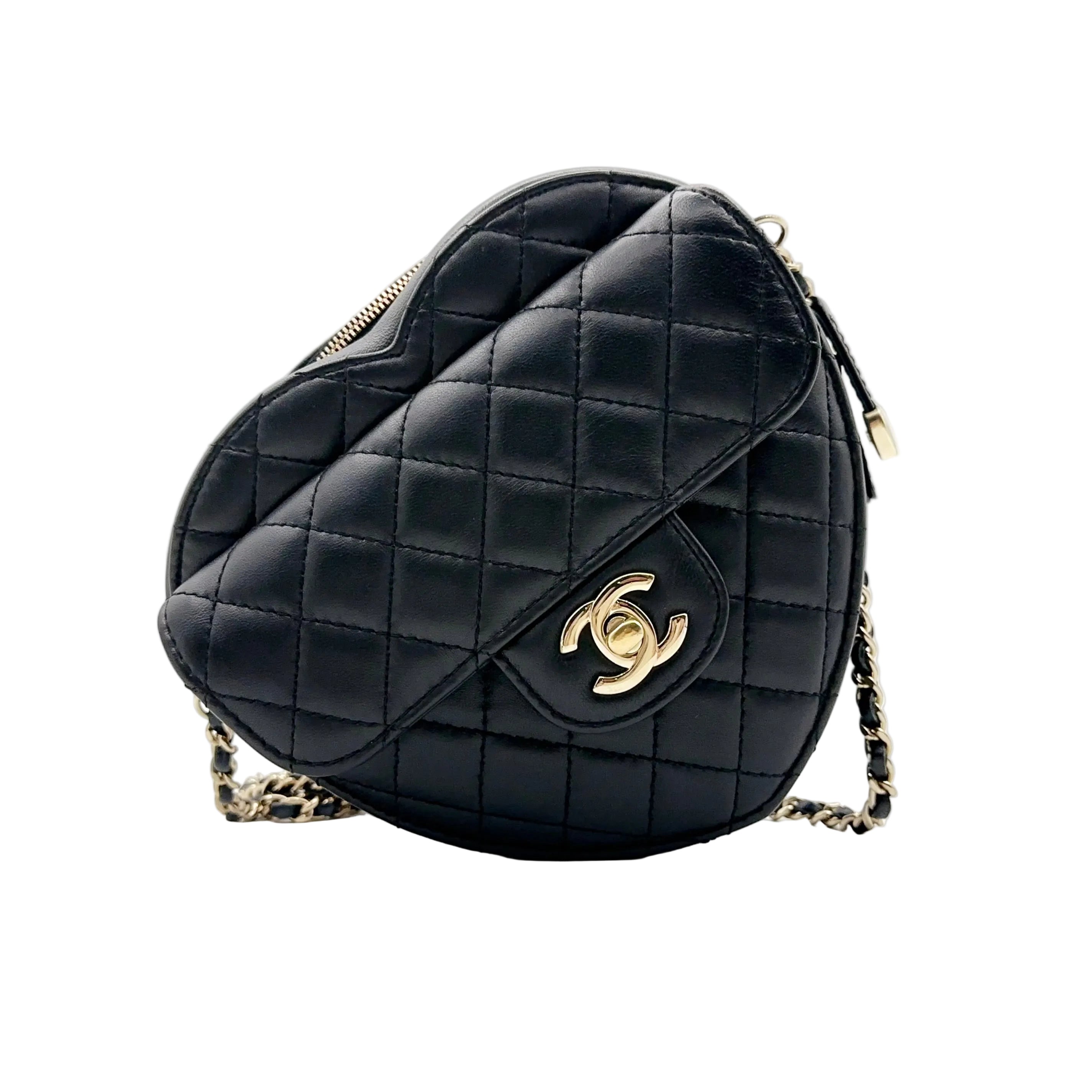 Front view of an authentic Chanel heart-shaped belt bag in black quilted lambskin, featuring a front flap with a gold-tone CC turn-lock and a chain-link strap on a white background.