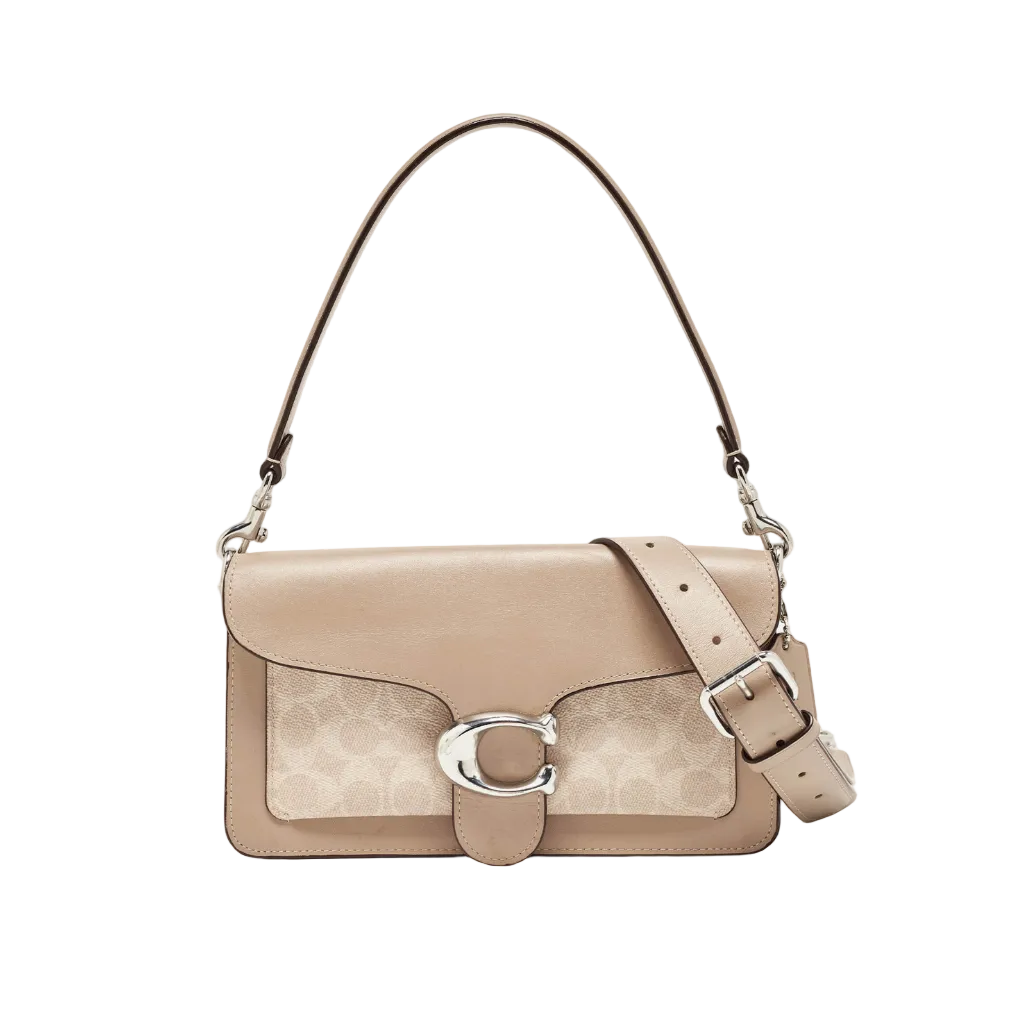 A Coach shoulder bag in beige and taupe leather with the brand's signature monogram pattern, a silver-tone 'C' logo clasp, and a matching adjustable shoulder strap, shown against a light gray background.