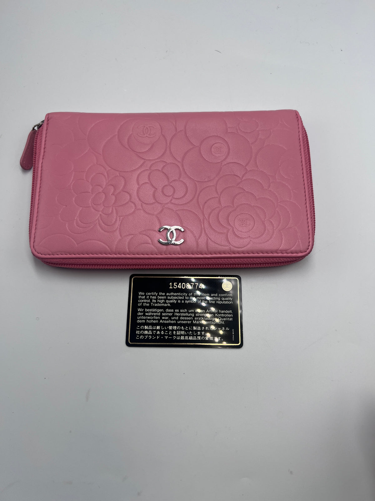 Chanel Camellia Embossed Zipped Long Wallet in Pink Lambskin with Silver Hardware