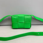 Bottega Veneta Candy Cassette Belt Bag in Parakeet Green Intreccio Leather