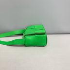 Bottega Veneta Candy Cassette Belt Bag in Parakeet Green Intreccio Leather