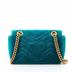 back view of prowned gucci small marmont crossbody handbag with Teal velvet with gold chain strap 