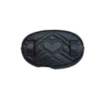 Black quilted belt bag with heart design on a light gray background