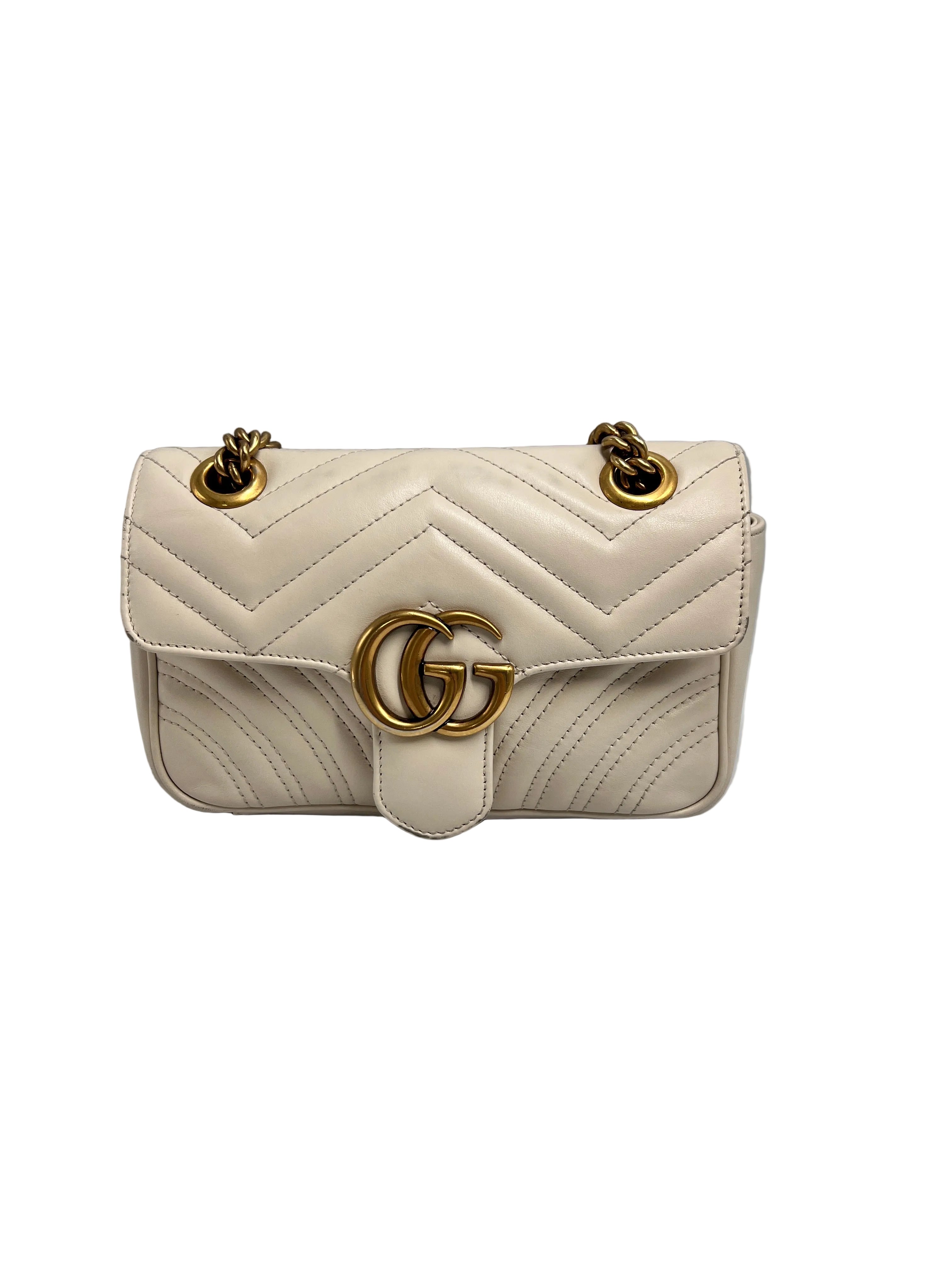 Authentic pre-owned Gucci GG Marmont matelassé small shoulder bag in white leather (22cm) featuring antique gold double G hardware and sliding chain strap.