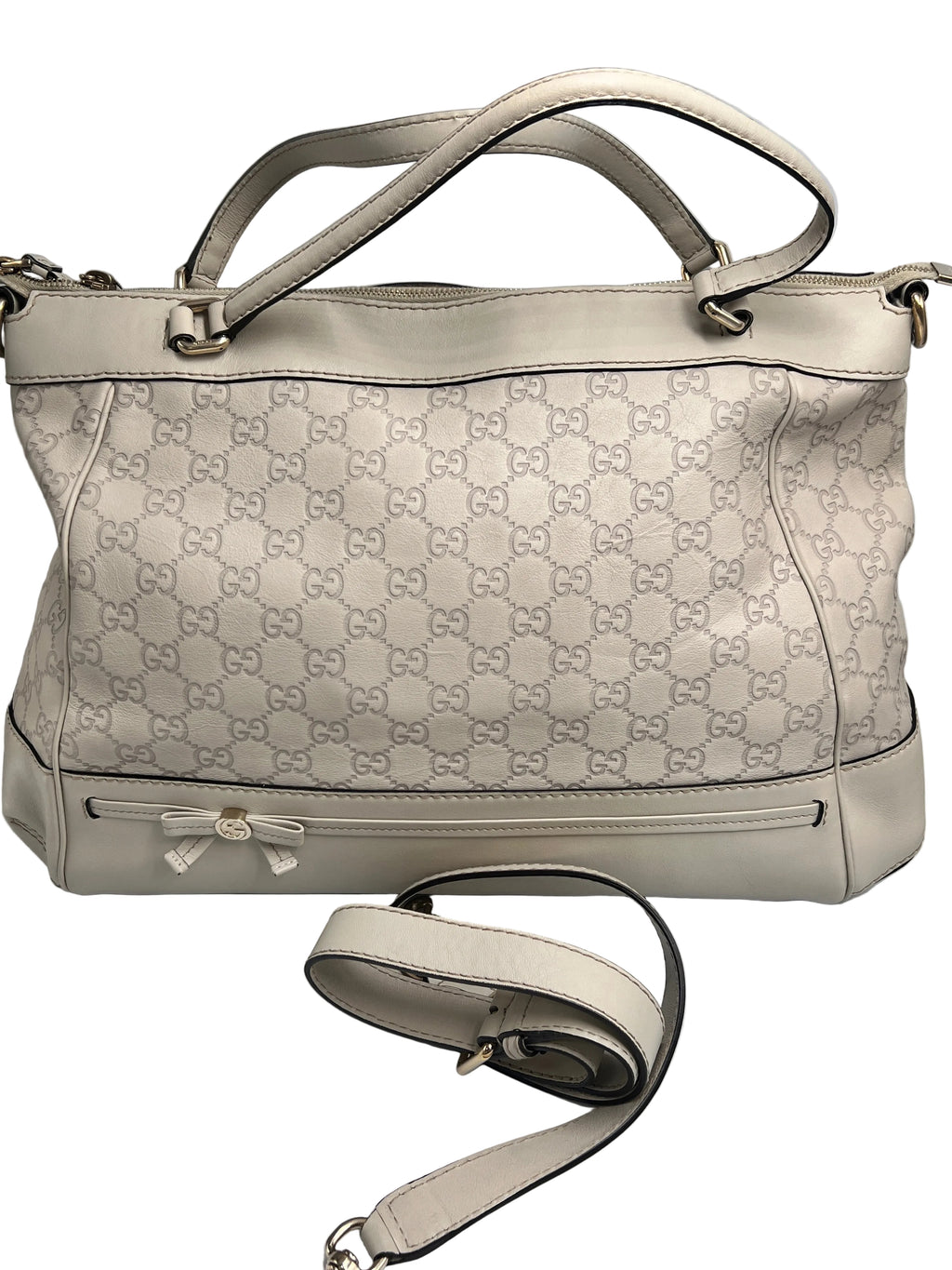 Authentic pre-owned Gucci white Micro Guccissima debossed leather tote bag featuring a bow accent, top handles, and original shoulder strap.