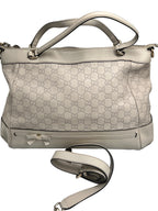 Authentic pre-owned Gucci white Micro Guccissima debossed leather tote bag featuring a bow accent, top handles, and original shoulder strap.
