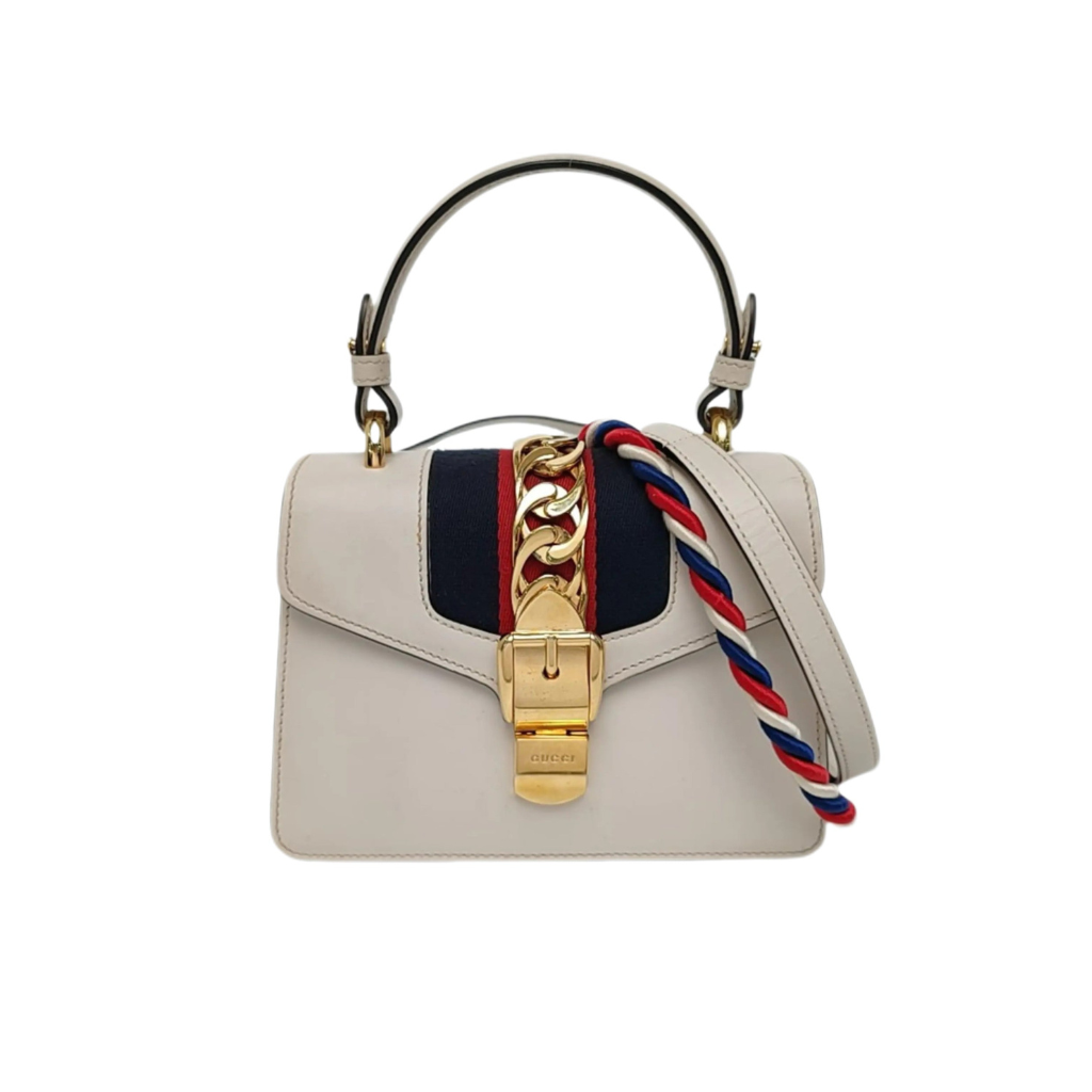 preloved gucci mini slyvie mini top handle with crossbody strap in white leather in very good condition shows no marks and stain for sale 