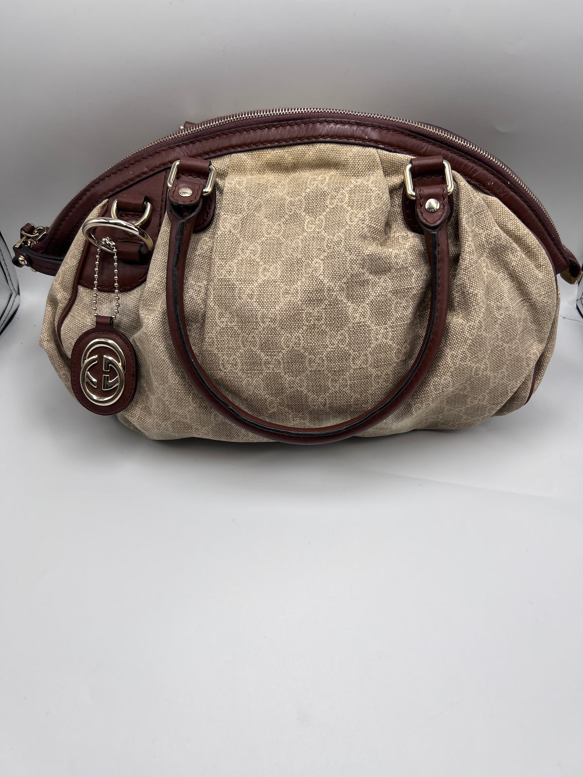 Gucci Sukey medium satchel bag in beige GG canvas with brown leather trim and GG charm accent