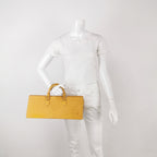 Mannequin holding a yellow LV vintage handbag with epi leather and lv logo 