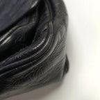 Close-up of black leather texture on niki medium bag