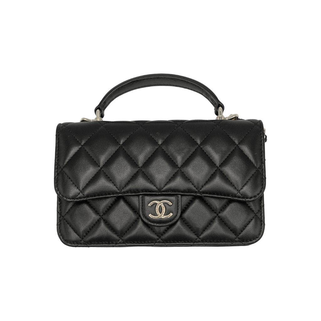 authentic preloved Black quilted handbag with Chanel logo in black lambskin leather with top handle in very good condition for sale 