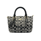 Front view of Coach Mini Kelsey Satchel in black and grey Signature monogram canvas with silver hardware.