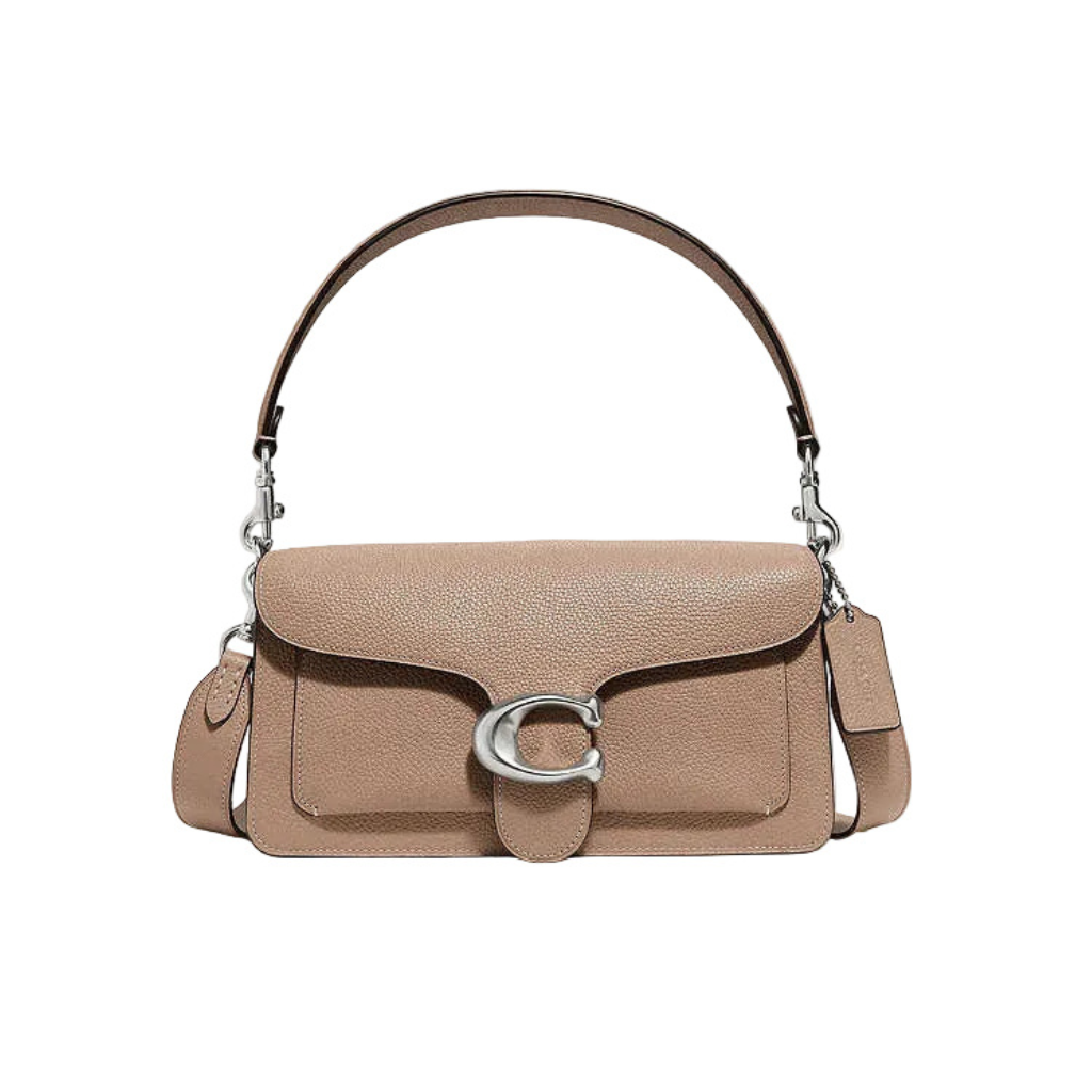 Front view of a Taupe Coach Tabby 26 bag with gold C hardware and matching crossbody strap on a white dust bag.