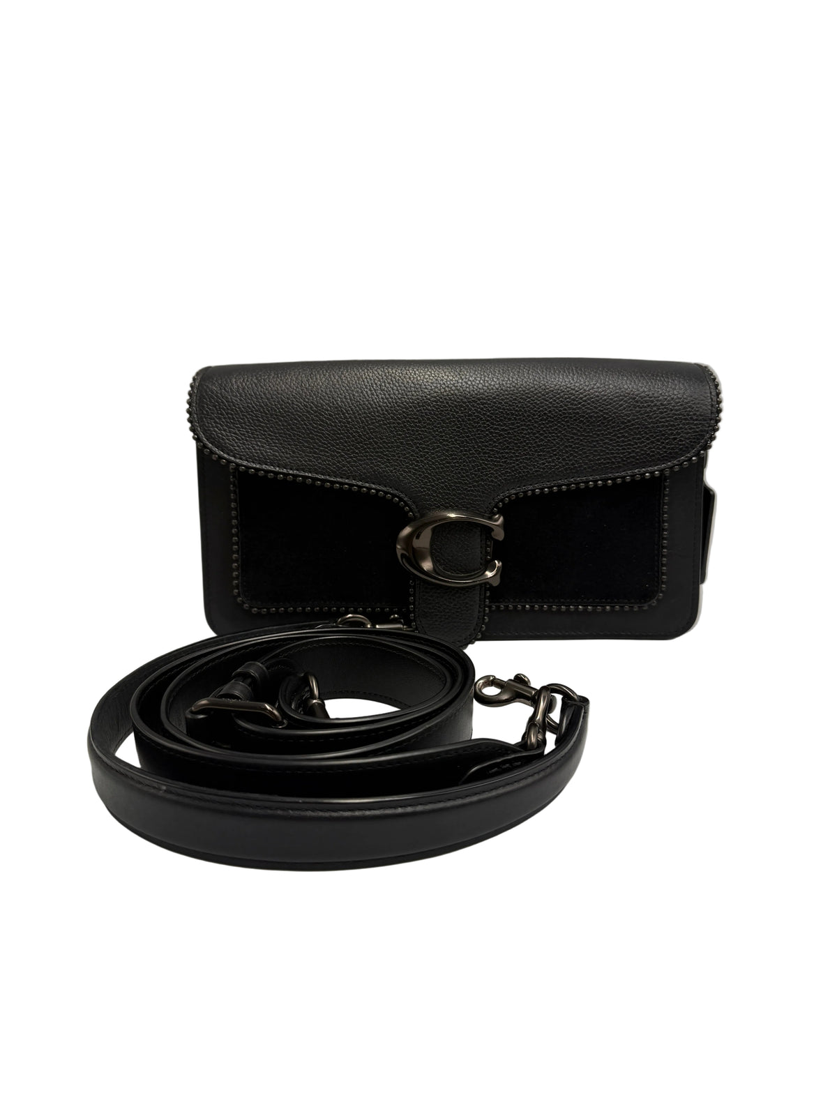 A black leather shoulder bag with a textured flap and a large silver-tone buckle, shown with its matching black leather strap coiled in front on a light gray background.