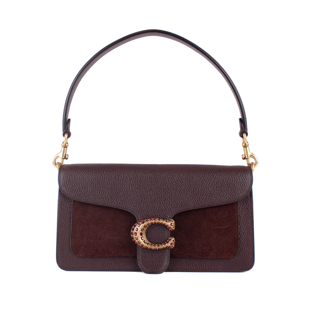 A dark brown structured handbag with a pebbled leather front flap, a suede panel, and a gold-tone C-shaped buckle closure, shown on a plain white background.