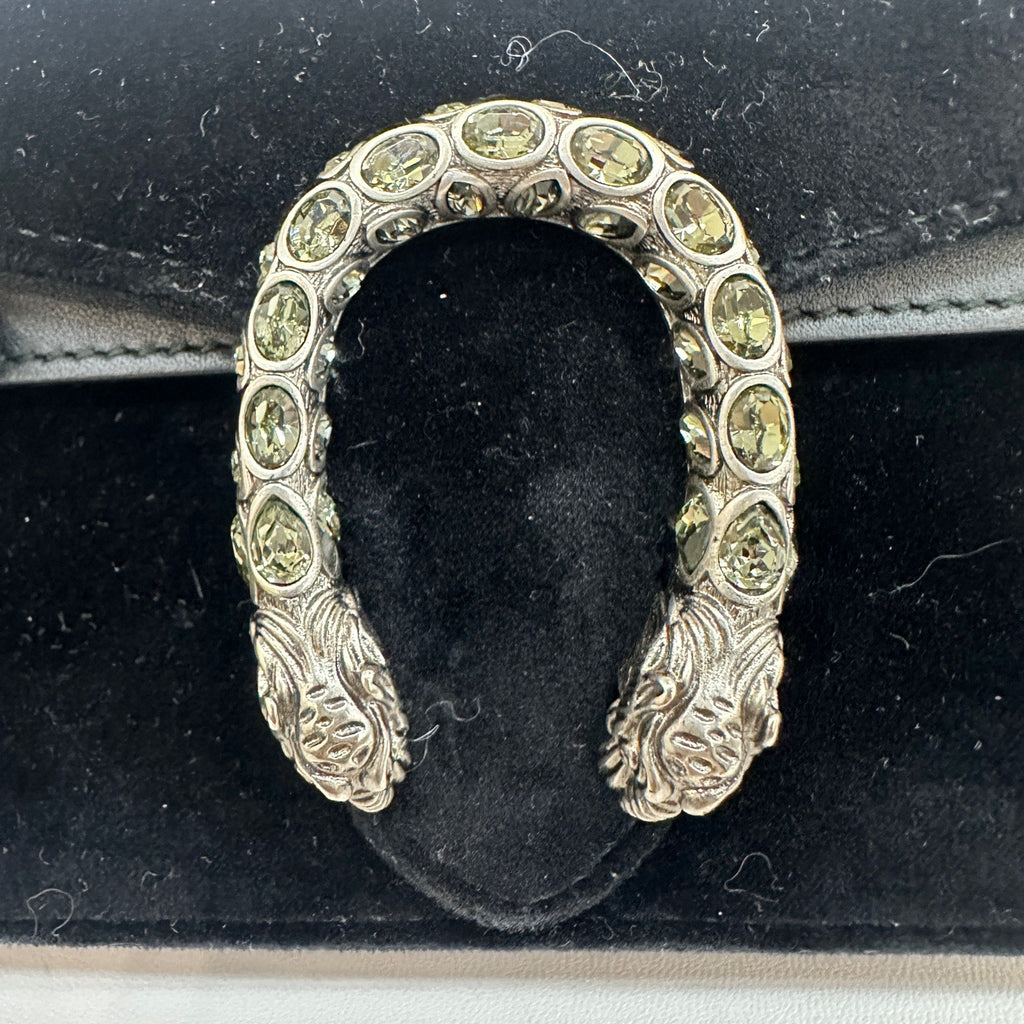 the detail of the silver tiger head hardware with stones from preloved gucci dionysus velvet