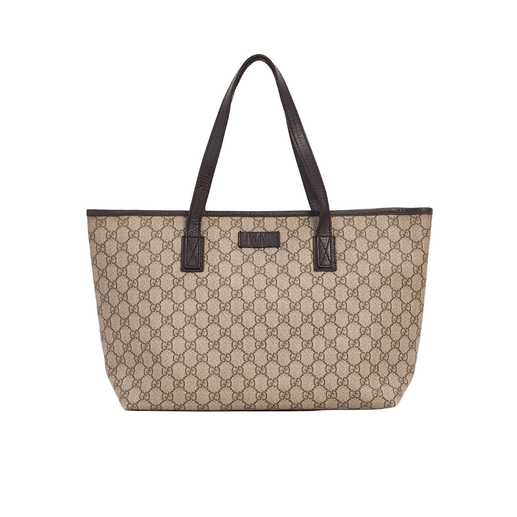 Authentic Gucci Joy Tote bag in beige and ebony GG Plus coated canvas with dark brown leather handles.