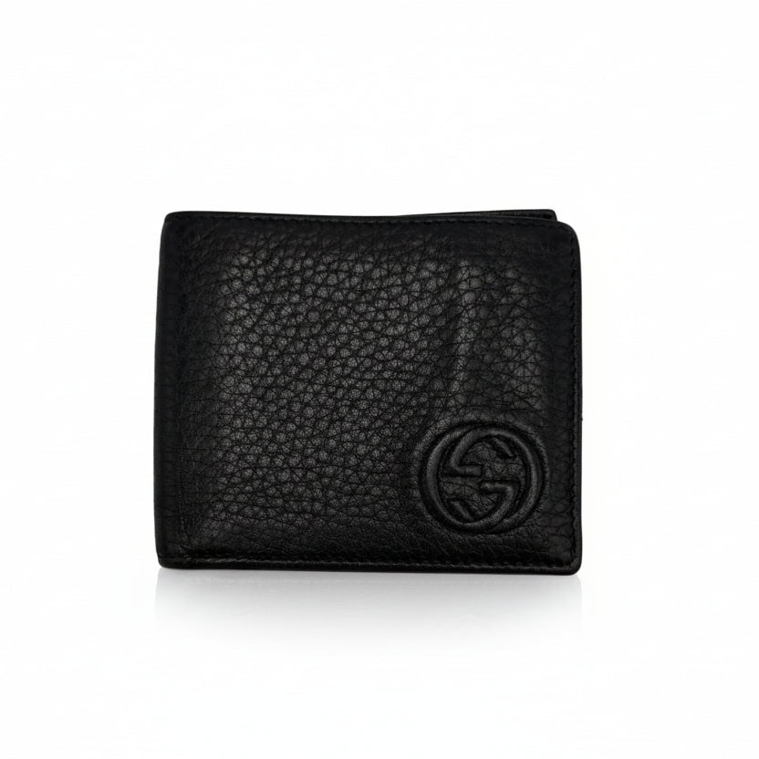 Front view of a black Gucci pebbled leather continental wallet with a gold-tone Interlocking G logo.