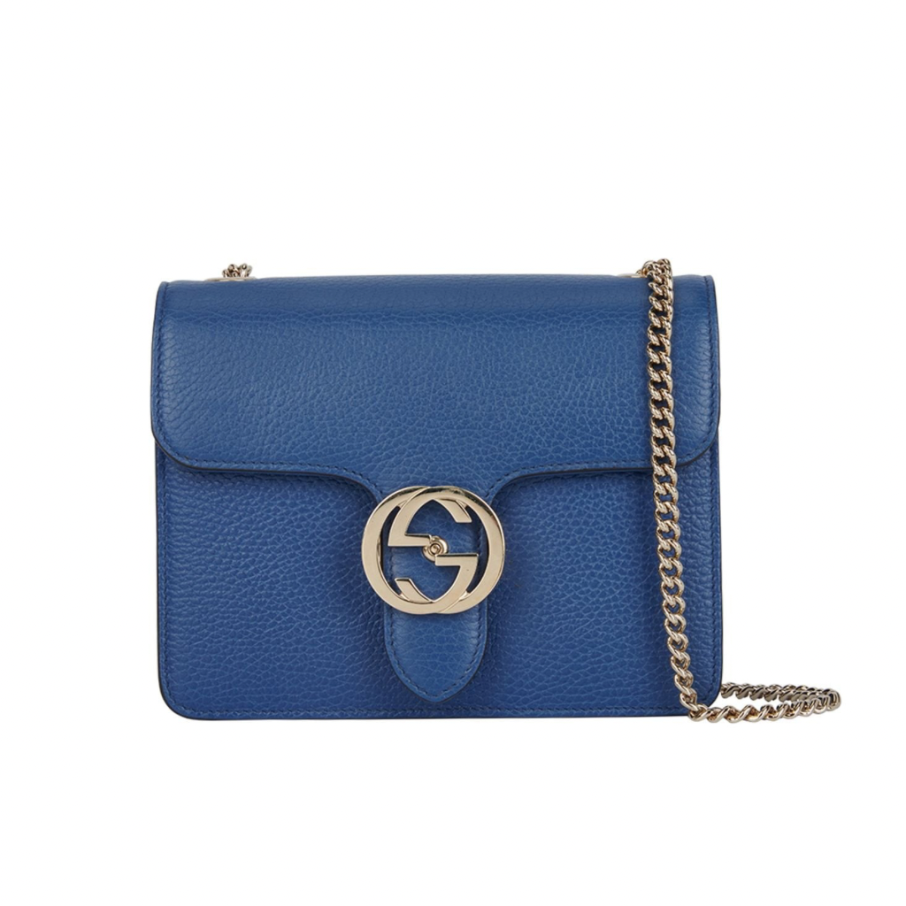 Front view of a black Gucci Interlocking G shoulder bag with gold-tone hardware and chain strap.