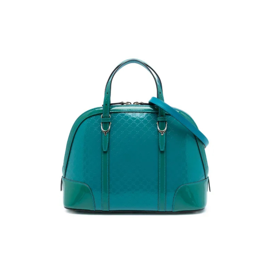 Front view of a structured Gucci Mini Dome bag in blue Micro Guccissima embossed patent leather.