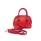Front view of a teal Gucci Microguccissima patent leather dome bag with gold-tone hardware and GG charm.