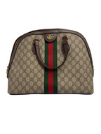 Front view of a Gucci Ophidia medium dome bag in GG Supreme canvas with brown leather handles, green and red Web stripe, and gold Double G hardware.