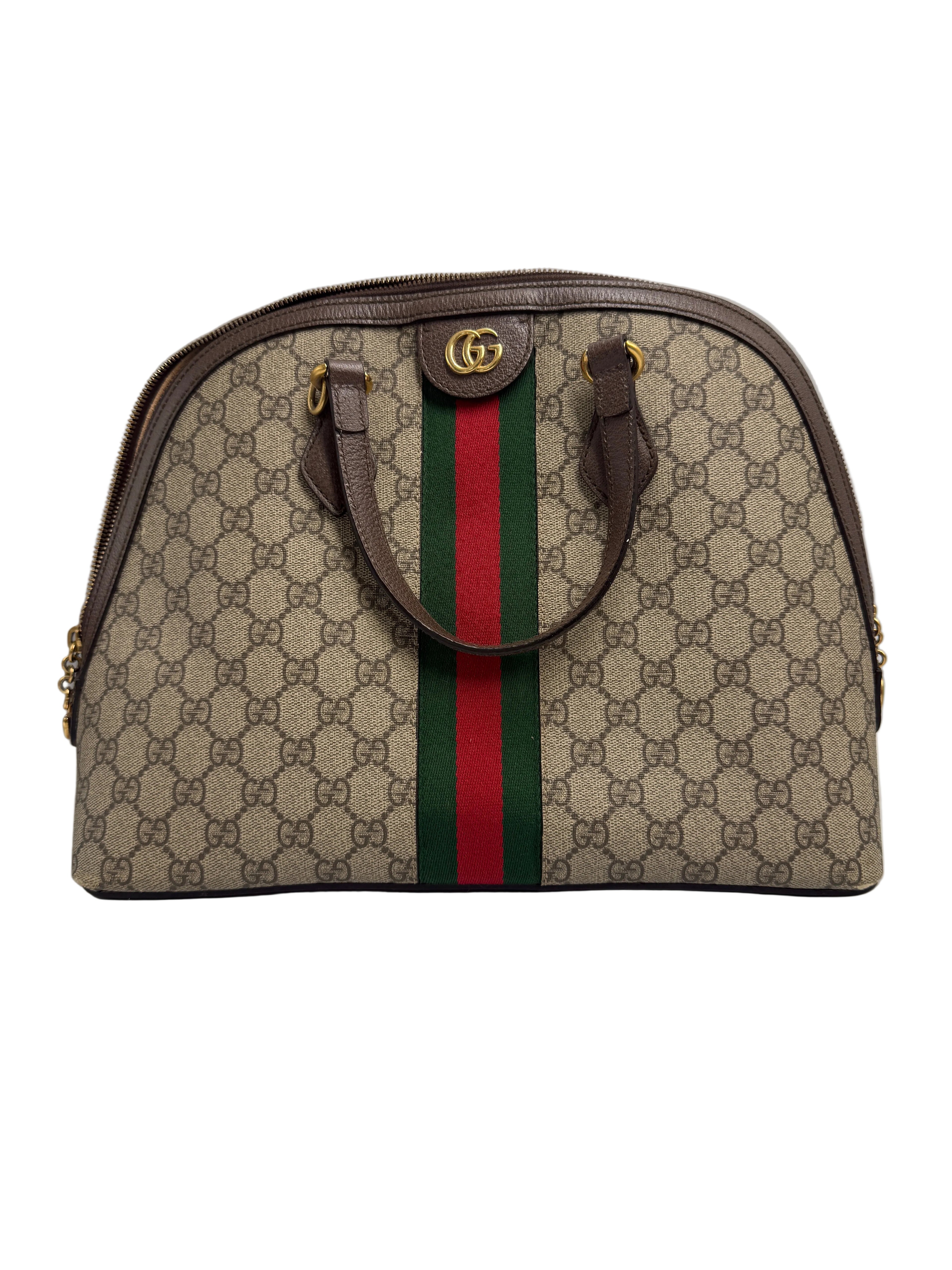 Front view of a Gucci Ophidia medium dome bag in GG Supreme canvas with brown leather handles, green and red Web stripe, and gold Double G hardware.
