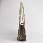 side of gucci padlock tote bag in gg canvas and white leather with shoulder strap 
