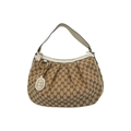 Front view of a Gucci Sukey shoulder bag in beige GG canvas with white leather trim and a gold-tone Interlocking G charm.