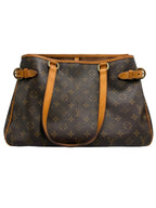 Front view of a vintage Louis Vuitton Batignolles Horizontal tote bag in Monogram canvas with tan vachetta shoulder straps and side buckles.