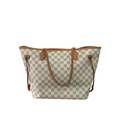 Front view of Louis Vuitton Neverfull MM tote bag in Damier Azur white and blue checkered canvas on a dark wood surface.