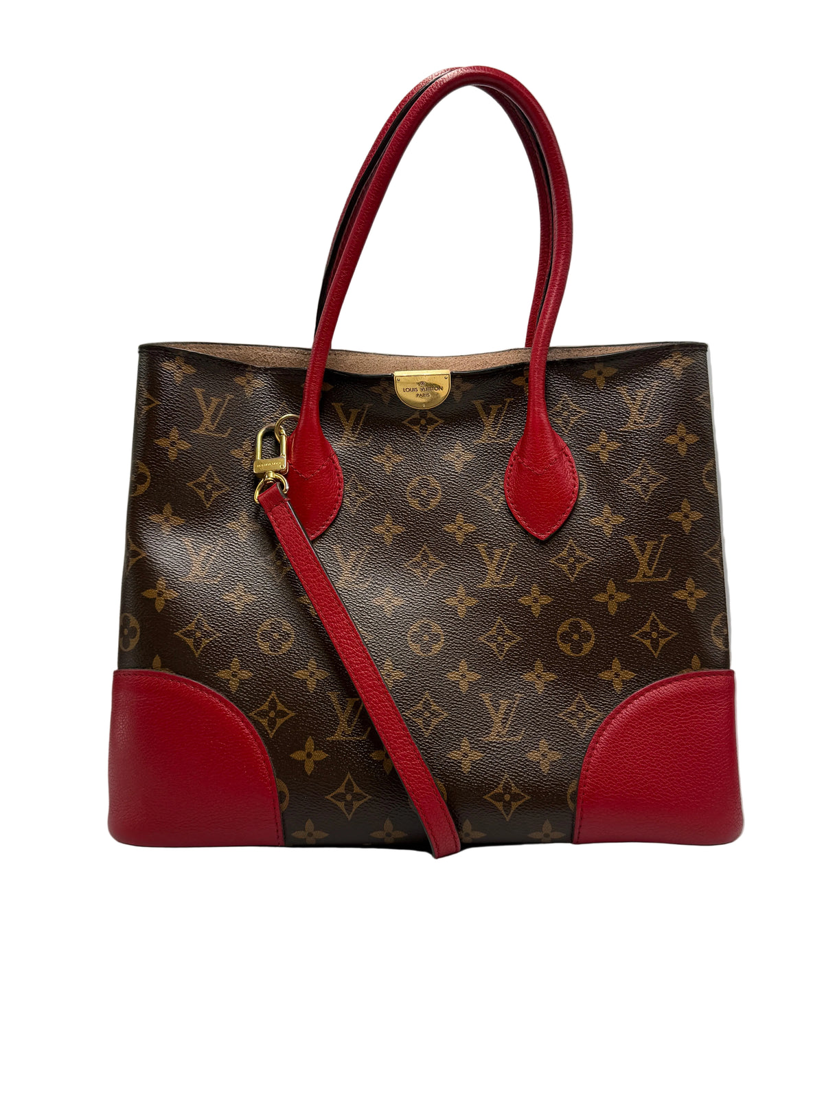 Front view of a Louis Vuitton Flandrin bag in Monogram canvas with red leather handles and corner accents.