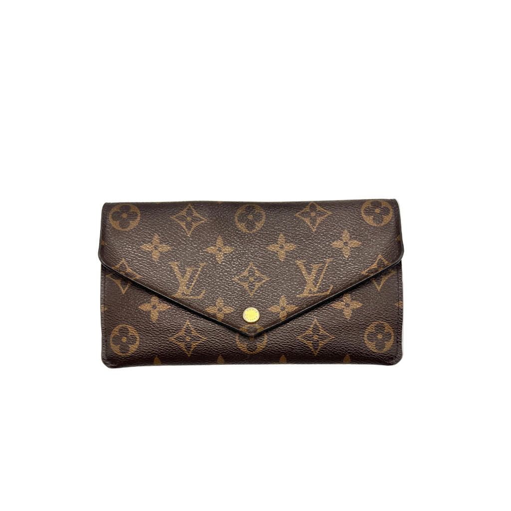 Front view of Louis Vuitton Jeanne Wallet in Monogram canvas with a Rose Ballerine pink press-stud closure.