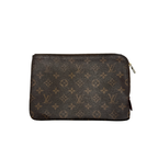 Louis Vuitton rectangular pouch in brown Monogram canvas with a zip-top closure and red grained leather interior