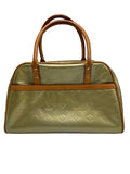 Front view of a vintage Louis Vuitton Monogram Vernis satchel in bronze patent leather with Vachetta handles.