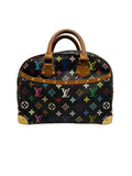Front view of a Louis Vuitton x Takashi Murakami Monogram Multicolore Trouville bag in black canvas with brass corner guards and vachetta handles.