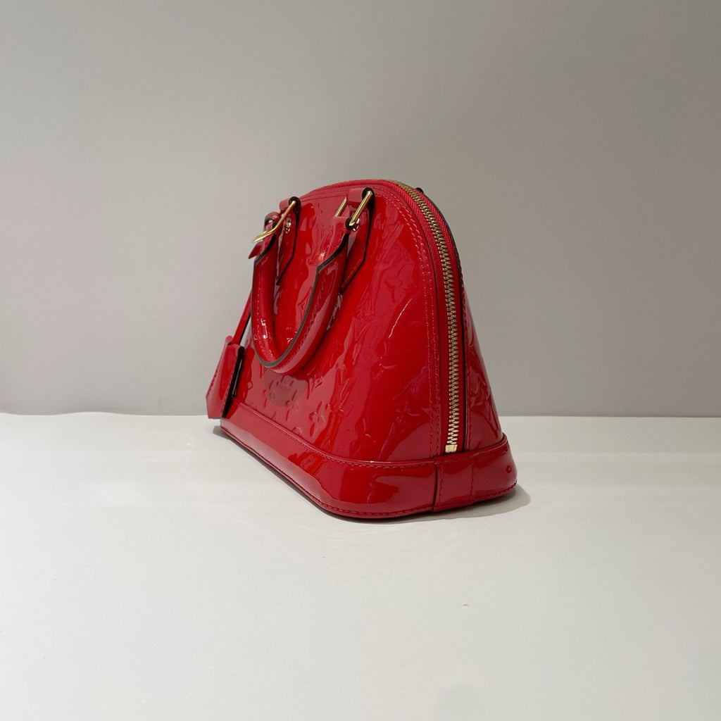 authentic preowned louis vuitton alma bb bag with classic monogram patent leather and gold hardware comes with lock and key in great condition 