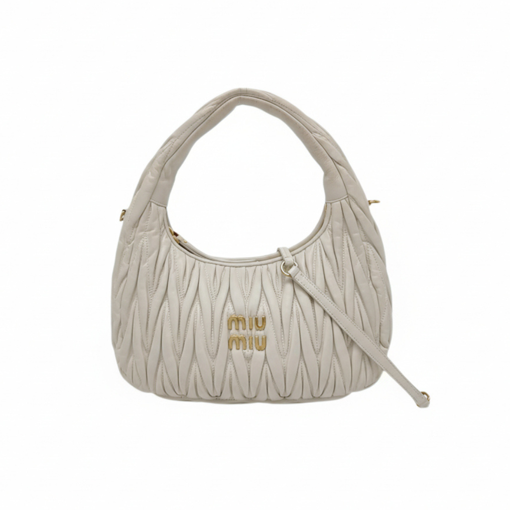 preloved authentic miu miu wander small hobo shoulder bag in white leather bag with gold miu miu logo in the front and zipper closure in very good condition for sale 