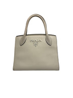 Front view of a Prada Saffiano Cuir Small Double bag in off-white leather with silver Prada Milano logo.