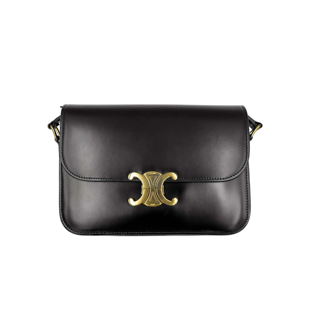 Black leather celine Triomphe handbag with a gold clasp on a white background
