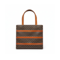 Front view of a vintage Celine horizontal tote bag in brown Macadam monogram canvas with tan leather straps.