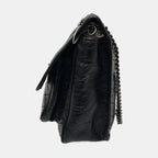 side of black ysl niki medium bag with black shoulder chain strap in great condition